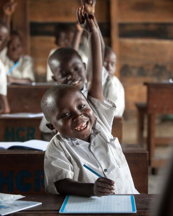 A learner smiling in class